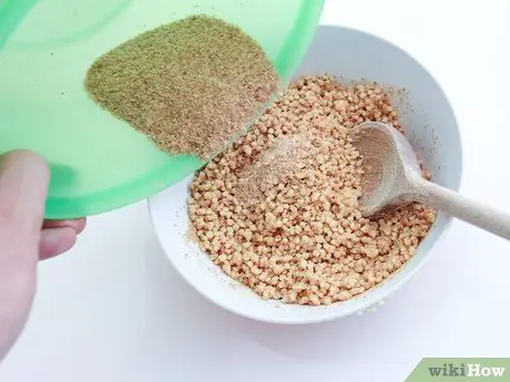 Приготовить куриные пальцы, покрытые киноа, шаг 3